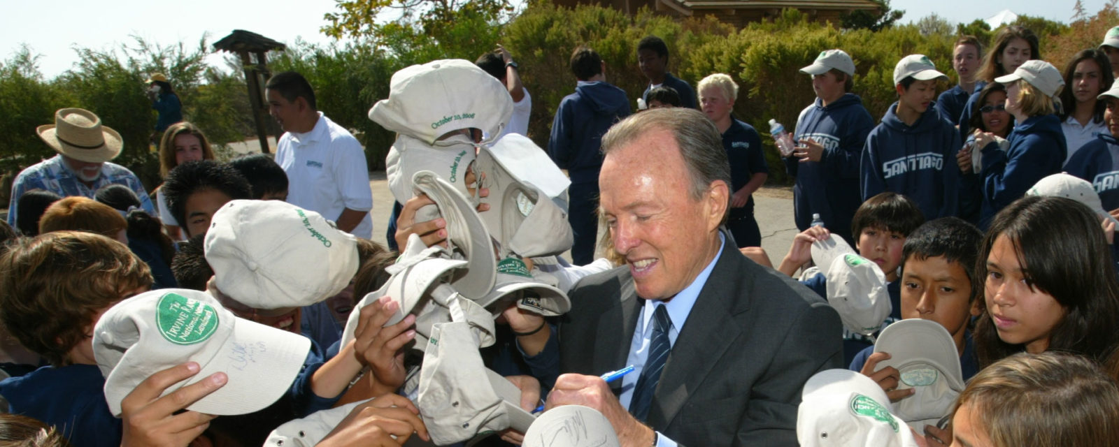 Donald Bren signing hats